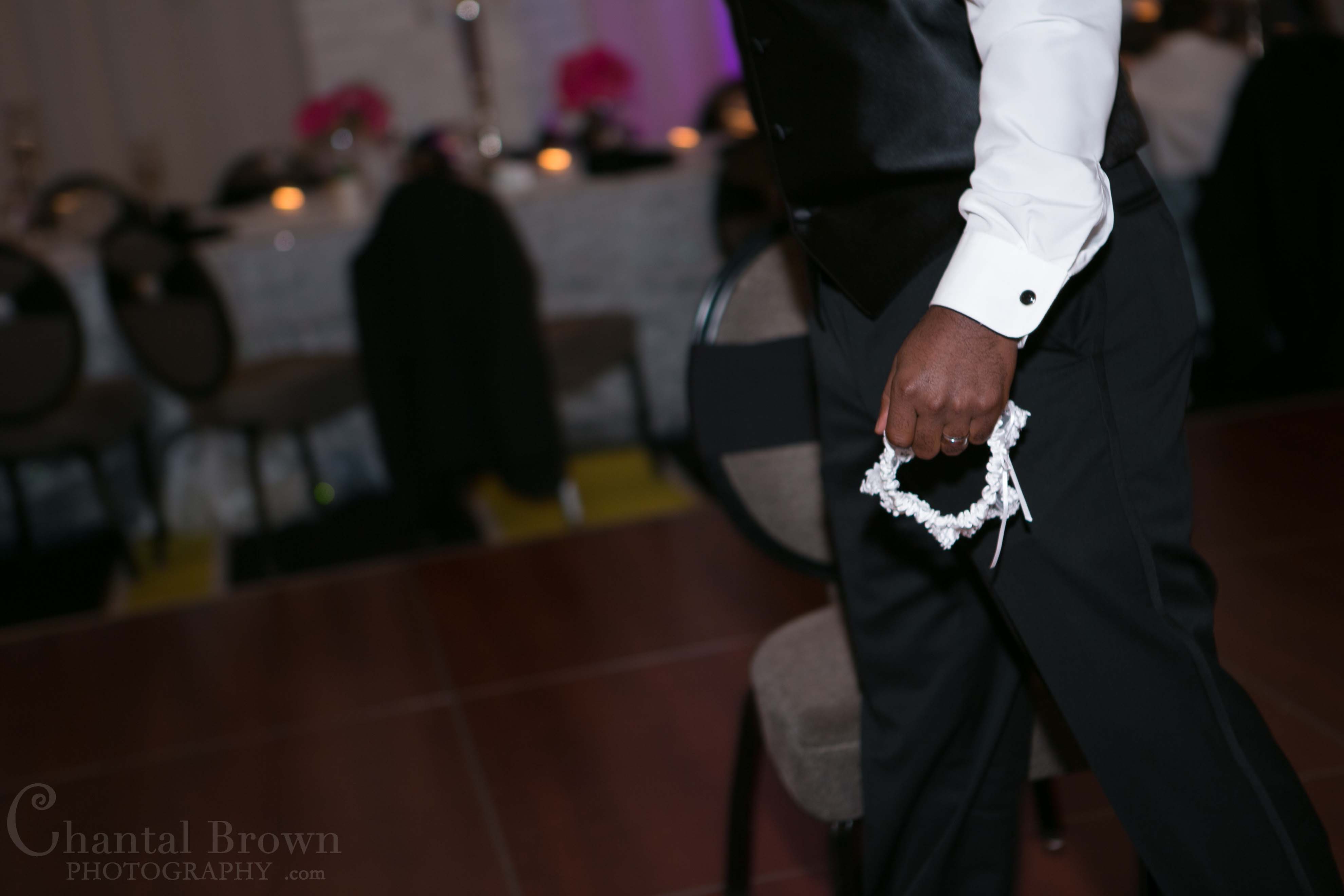 garter toss at NYLO Hotel wedding reception Dallas Wedding Photographer
